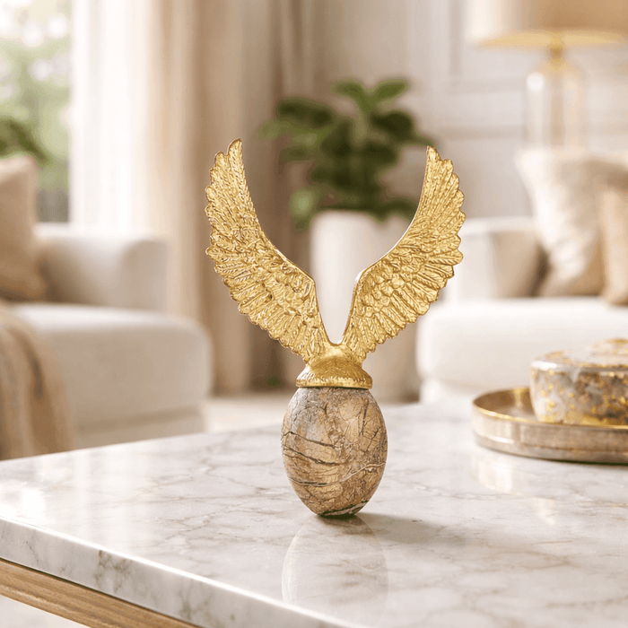 Golden Flying Egg Sculpture